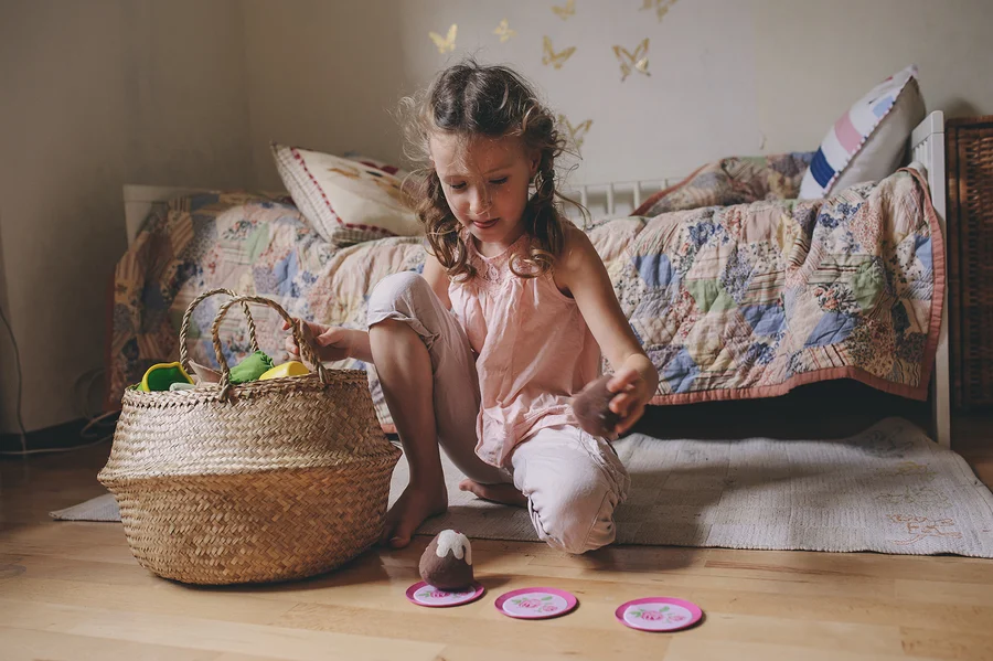 girl by time-out basket